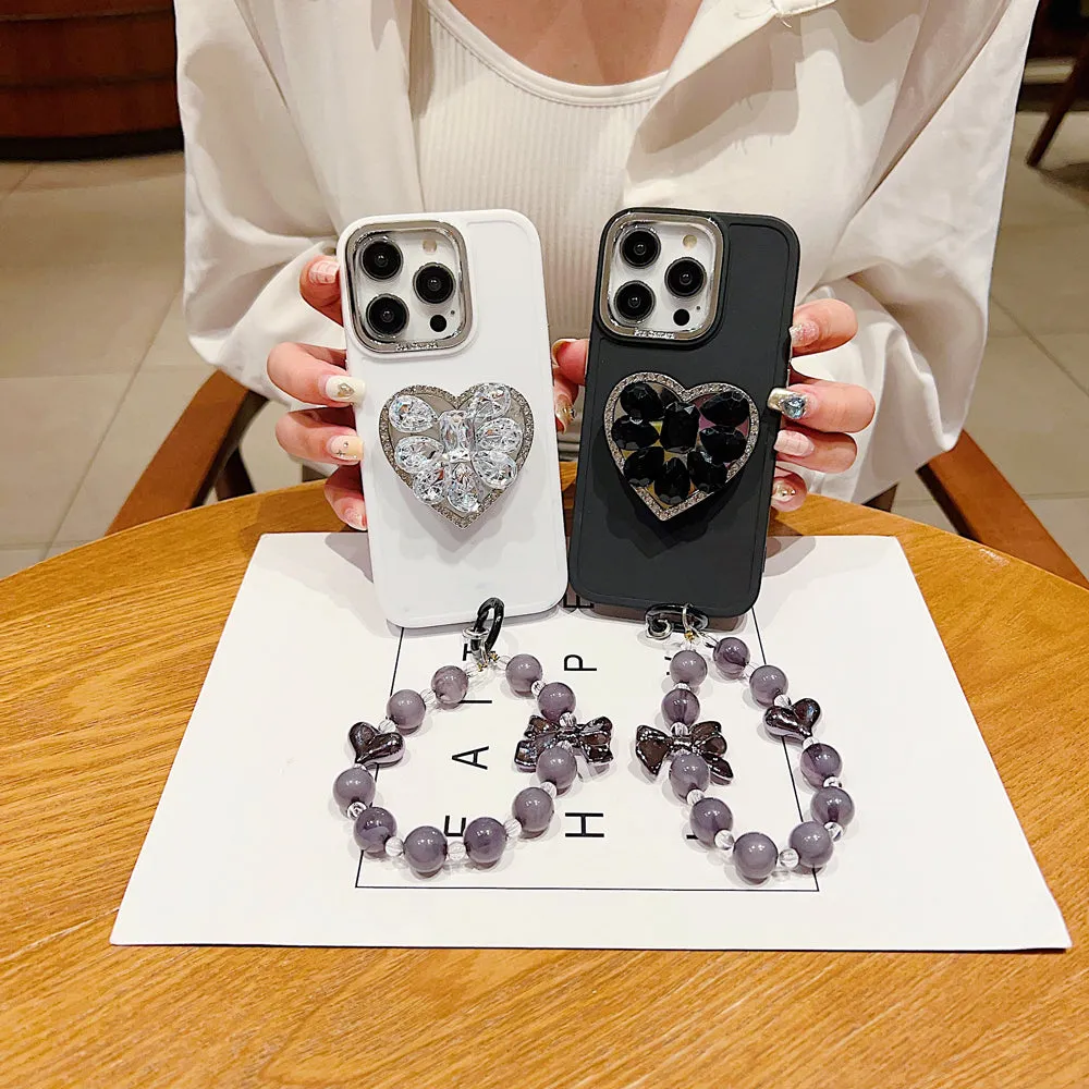 Stone Heart Shape Stand Silicone Soft Phone Cover with Bracelet - iPhone 16